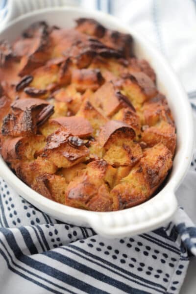 breakfast casserole with bread in a white dish