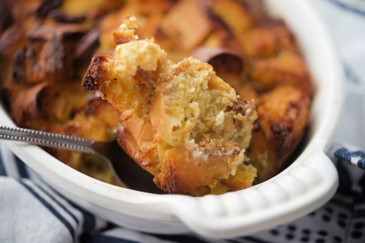 A close up of cut up bread on a spoon