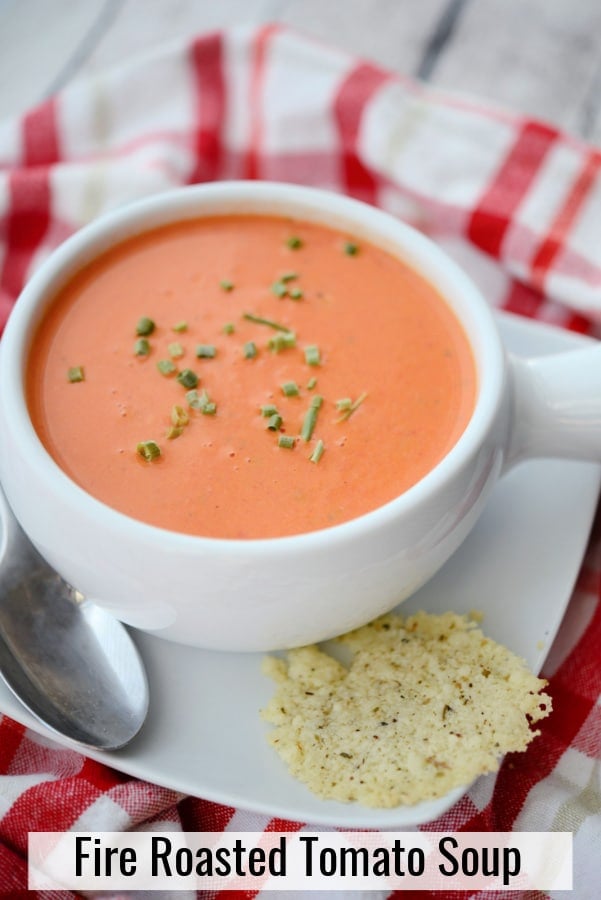 tomato soup in a white soup crock