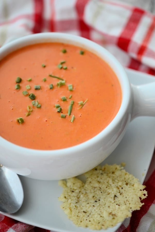 tomato soup in a white crock