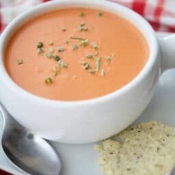 A close up of tomato soup in a bowl