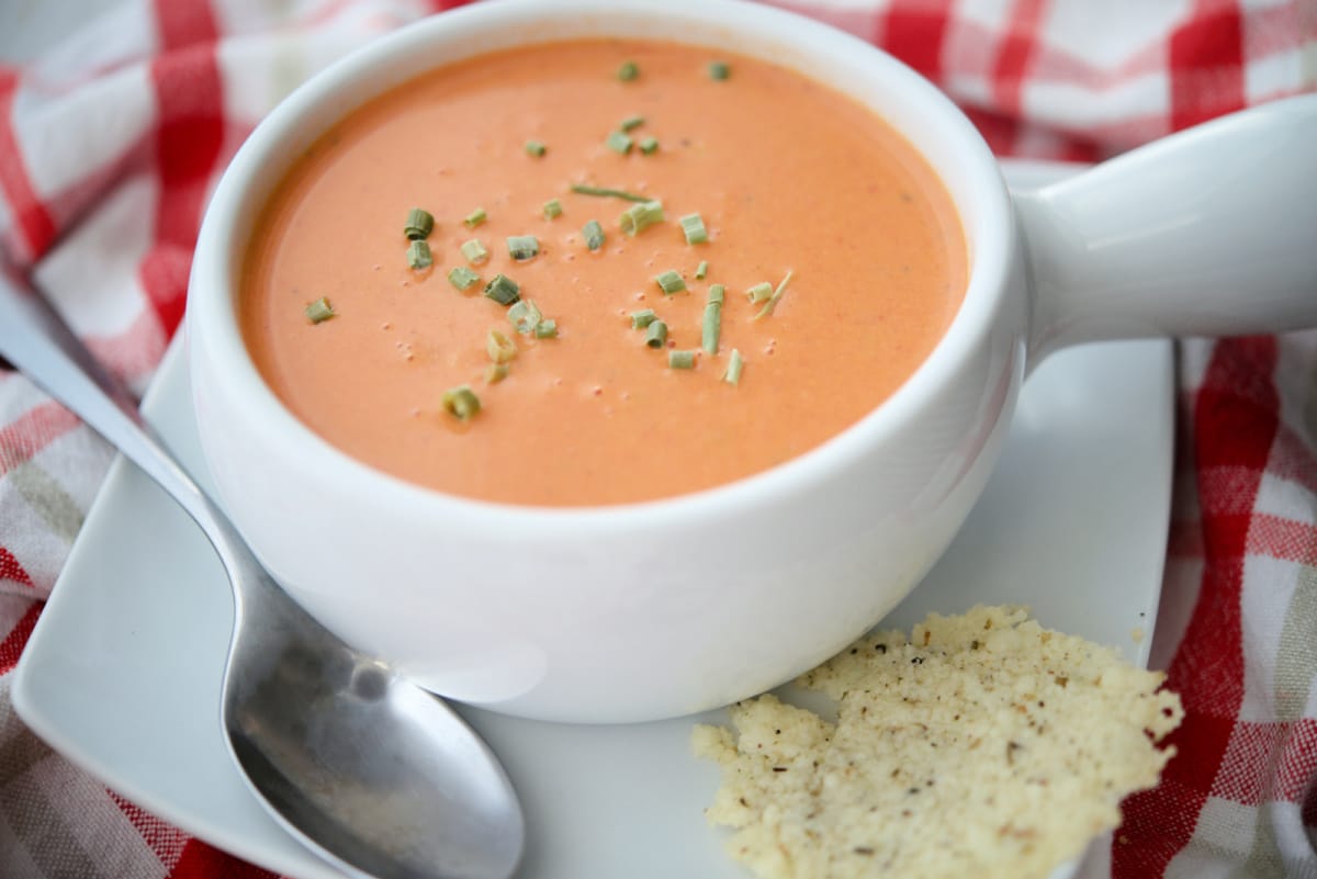 A close up of tomato soup in a bowl