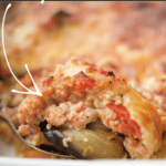 a close up of ground chicken moussaka on a spoon