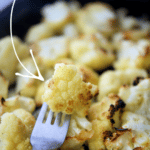 cauliflower roasted with garlic on a fork