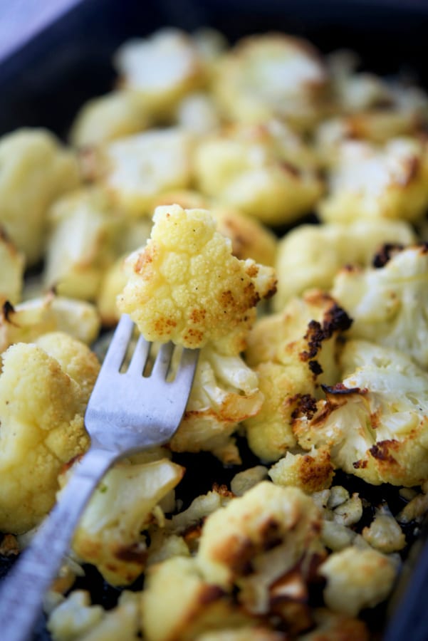 garlic roasted cauliflower on a fork