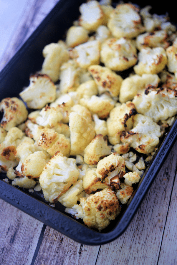 roasted cauliflower in a baking pan