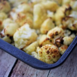 a close up of garlic cauliflower in a pan