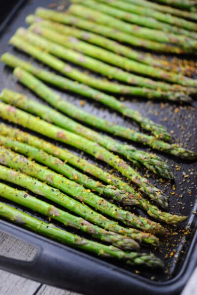 lemon pepper asparagus on a pan