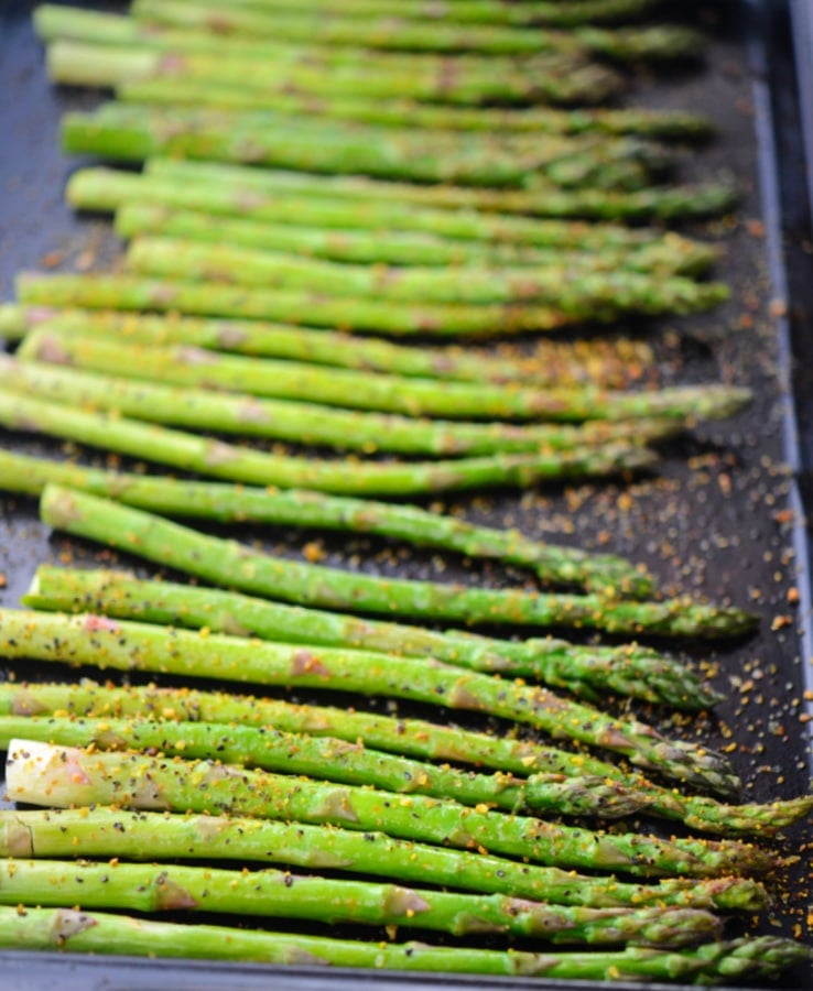 a single layer of cooked asparagus on a pan