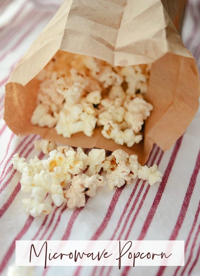 popped popcorn in a brown paper bag