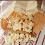 microwave popcorn in a bag on a red and white napkin