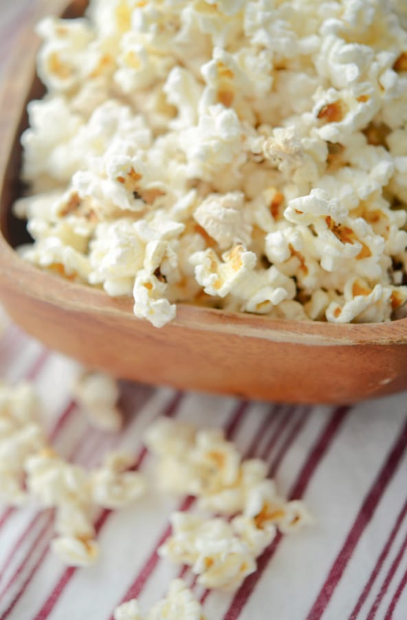 popped popcorn in a wooden bowl