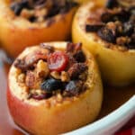 a close up of apples in a white dish