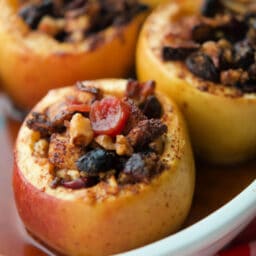 a close up of apples in a white dish