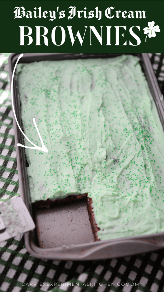 irish cream chocolate brownies in a pan with green frosting