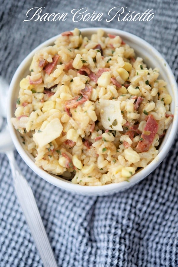 a bowl of risotto with corn and bacon