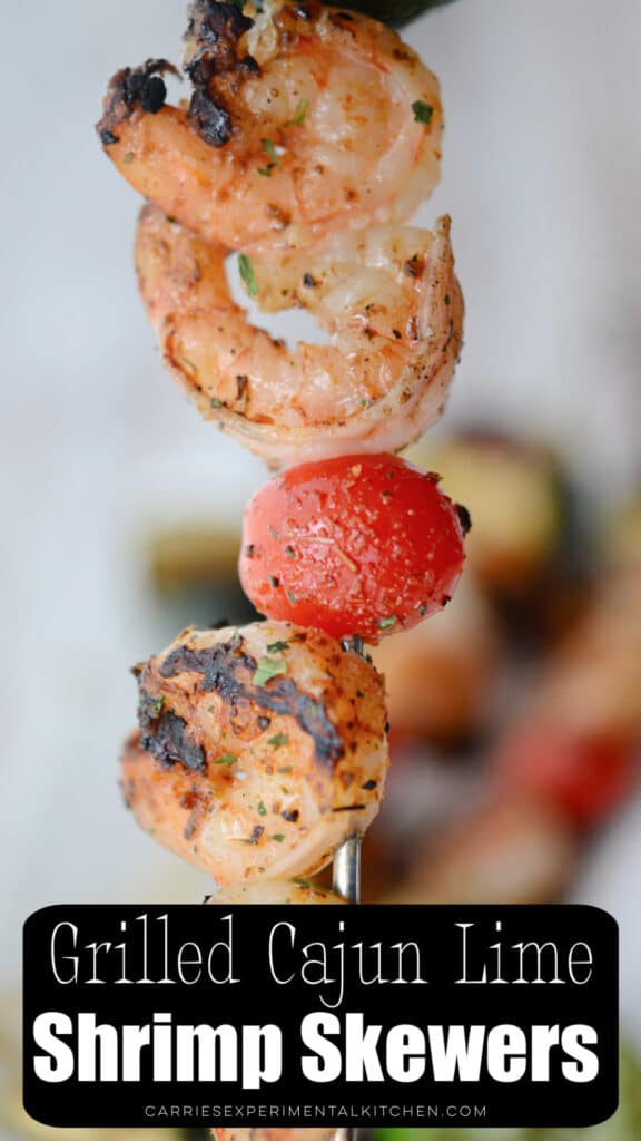 shrimp on a skewer with a tomato