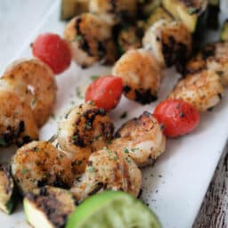 three grilled shrimp skewers