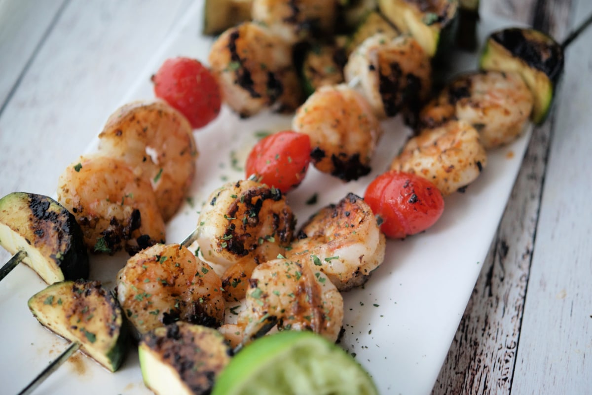 three grilled shrimp skewers