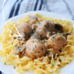 chicken meatballs with mushrooms on egg noodles