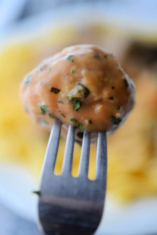 a chicken meatball on a fork