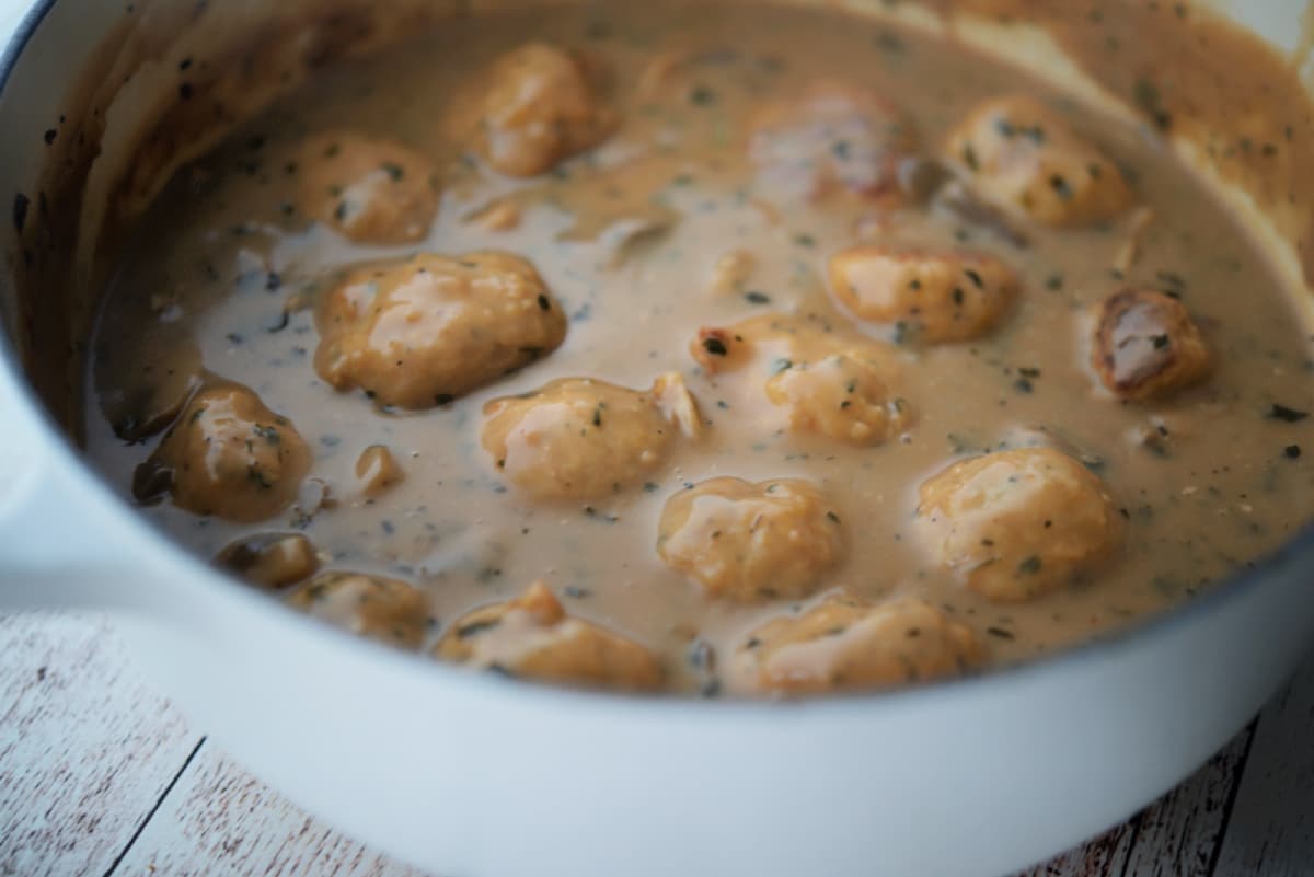 a close up of a pot of meatballs