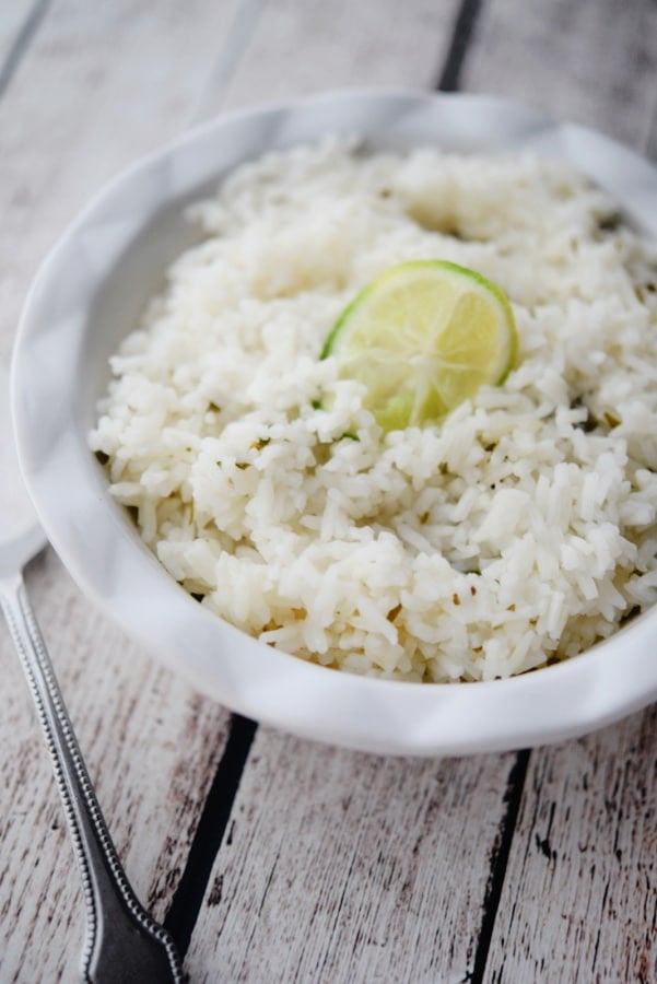 white rice in a bowl on a wooden table