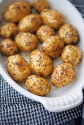 cooked new potatoes in a white dish