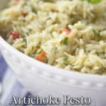 a close up of orzo pasta salad in a white bowl