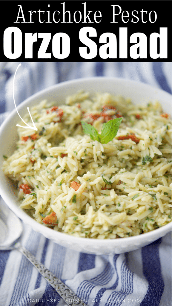 orzo salad with artichoke pesto in a white bowl