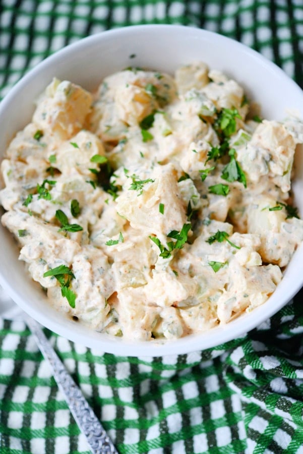 potato salad with cajun seasonings in a white bowl