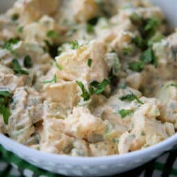a close up of potato salad in a bowl