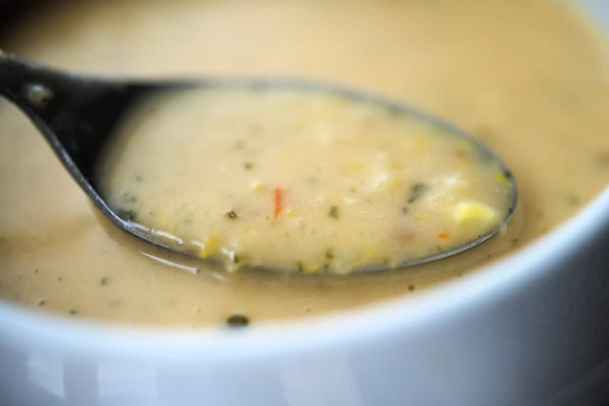 corn tomato chowder on a spoon