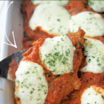 drunken chicken parmesan in a white baking dish