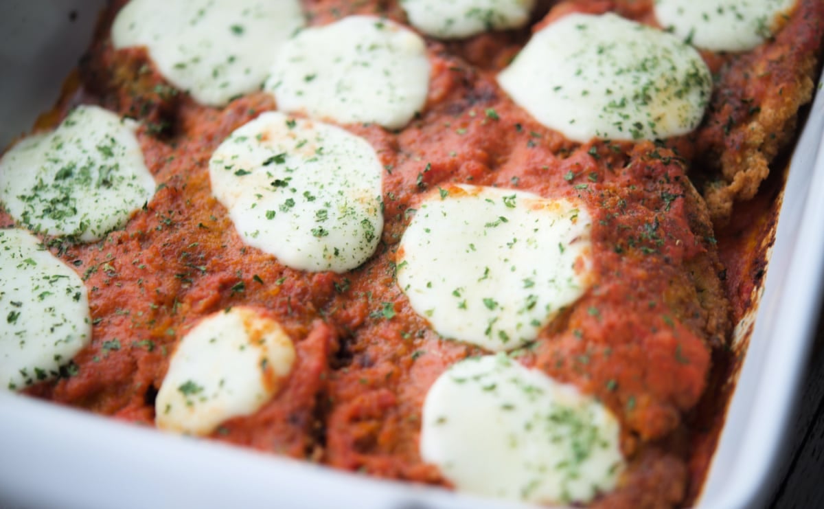 chicken parm with vodka sauce in a white dish