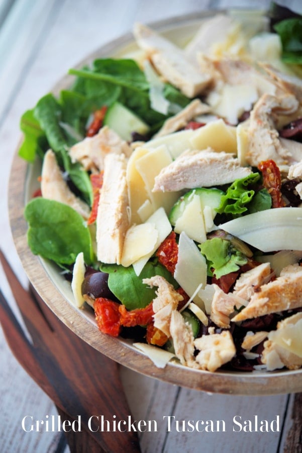 salad in a wooden bowl with chicken