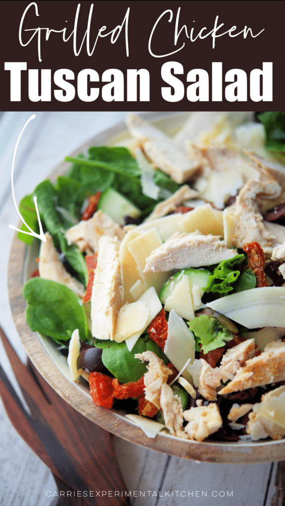 tuscan mixed green salad in a bowl with chicken