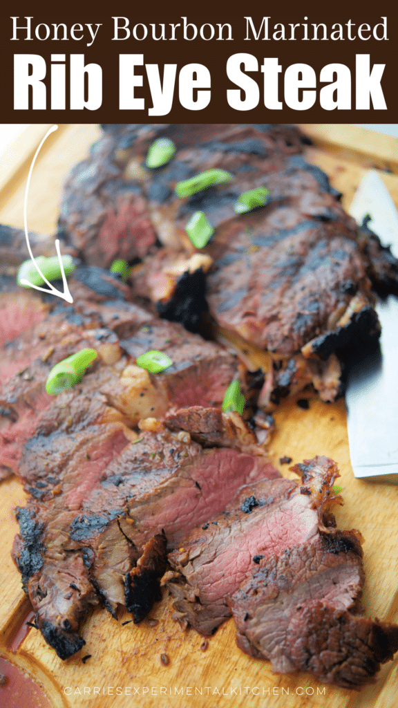 cooked sliced steak on a wooden cutting board