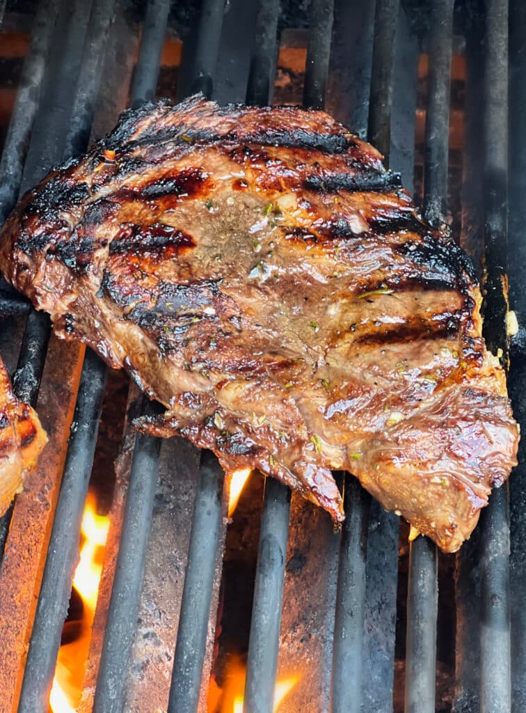 steak cooking on a grill