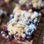 a blueberry oatmeal crumb bar on a cooling rack