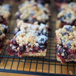 crumb bars with blueberries on a cooling rack