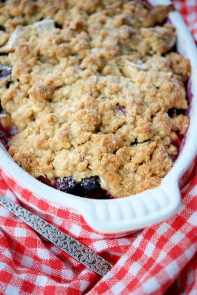 apple blueberry crisp in a white dish