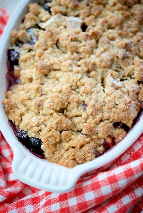 overhead picture of blueberry apple crisp in a white dish