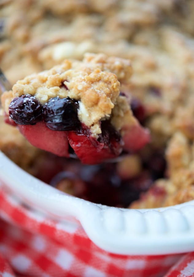 apple blueberry crisp on a spoon