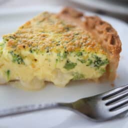 a close up of a piece of broccoli quiche