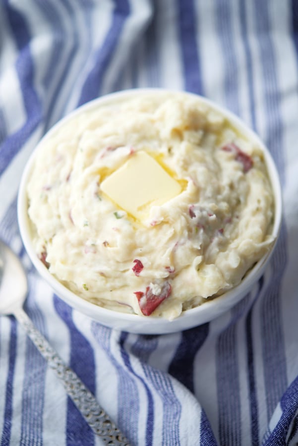 overhead picture of mashed potatoes in a white bowl