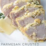 parmesan pork chops sliced on a plate