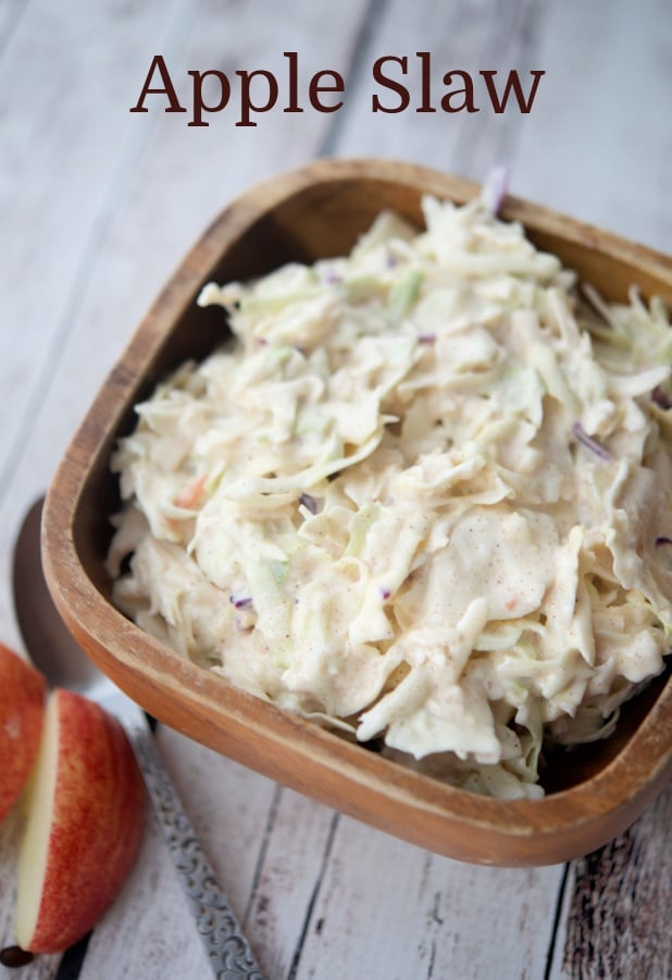 coleslaw in a wooden bowl on a wooden table