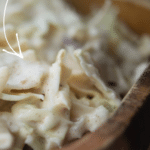Apple Slaw in a wooden bowl close up