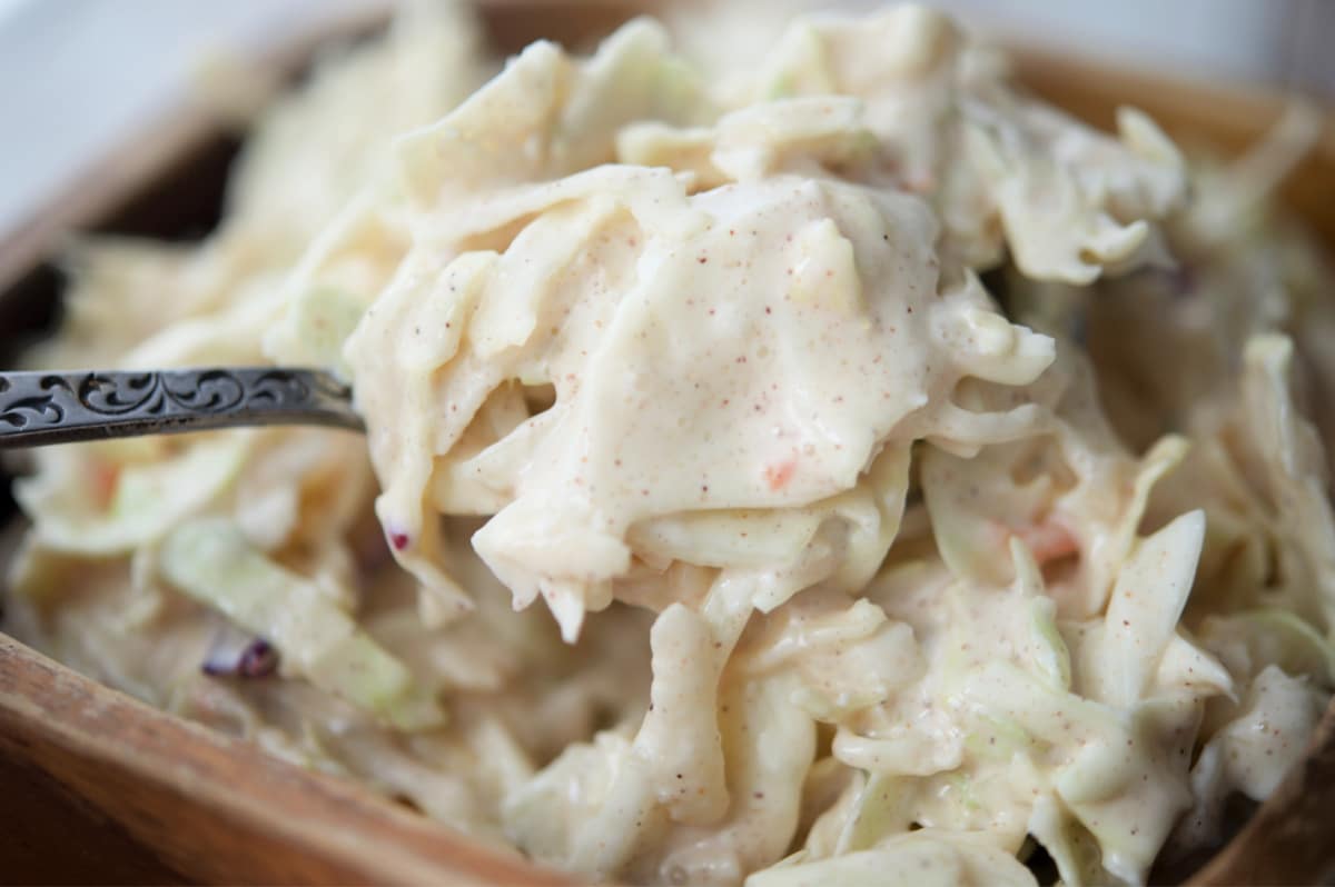 apple coleslaw on a spoon